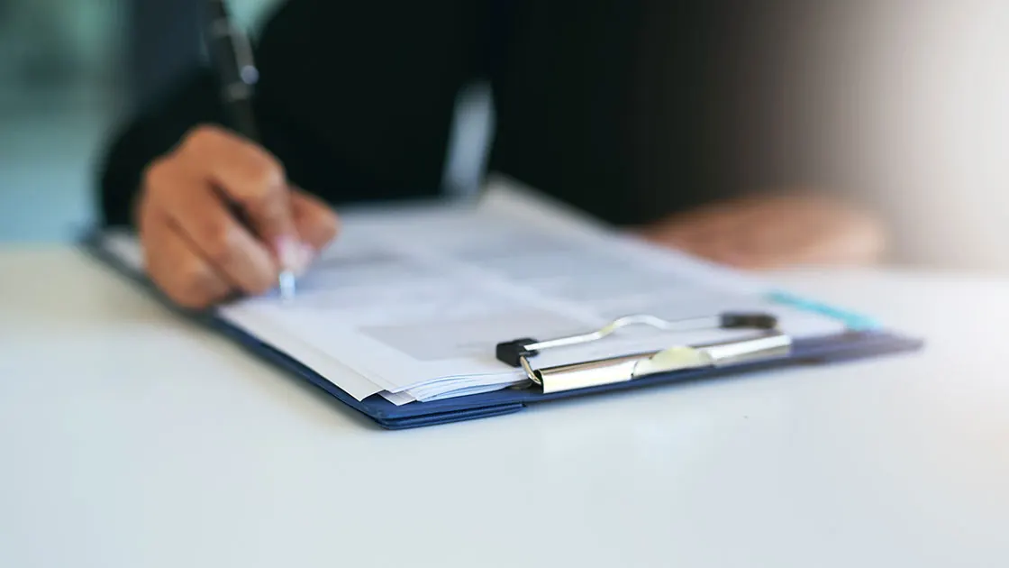 Patient forms on a clipboard, ready to be completed.