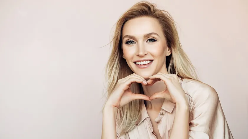 A patient smiling after cosmetic treatment.
